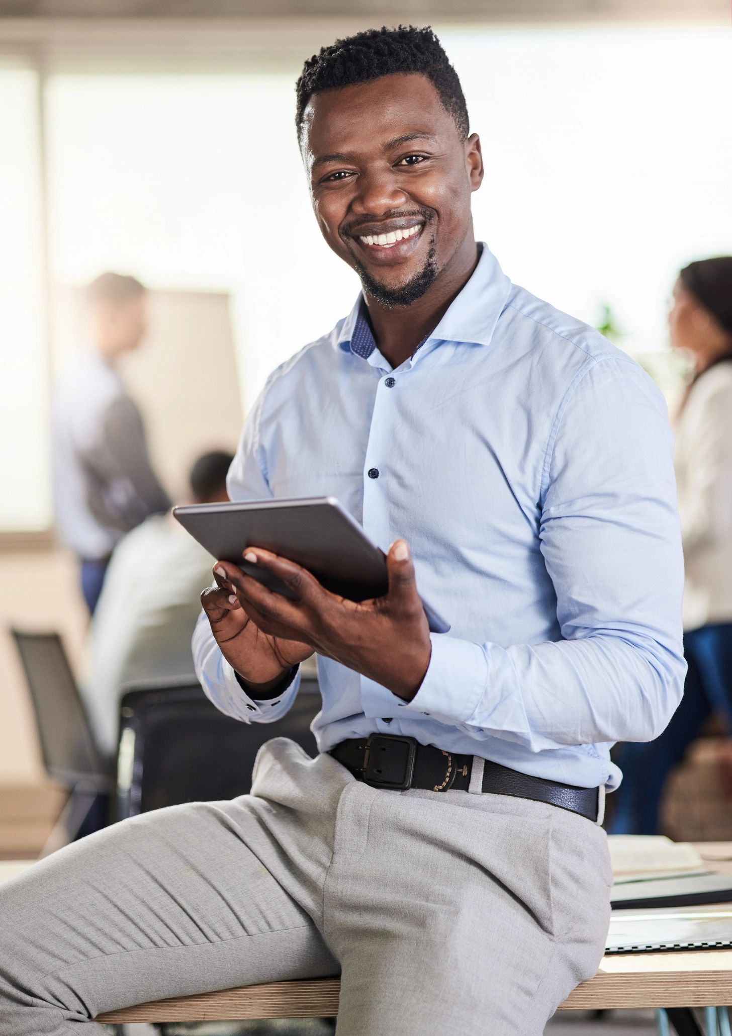 Professional consultant using a tablet in an office